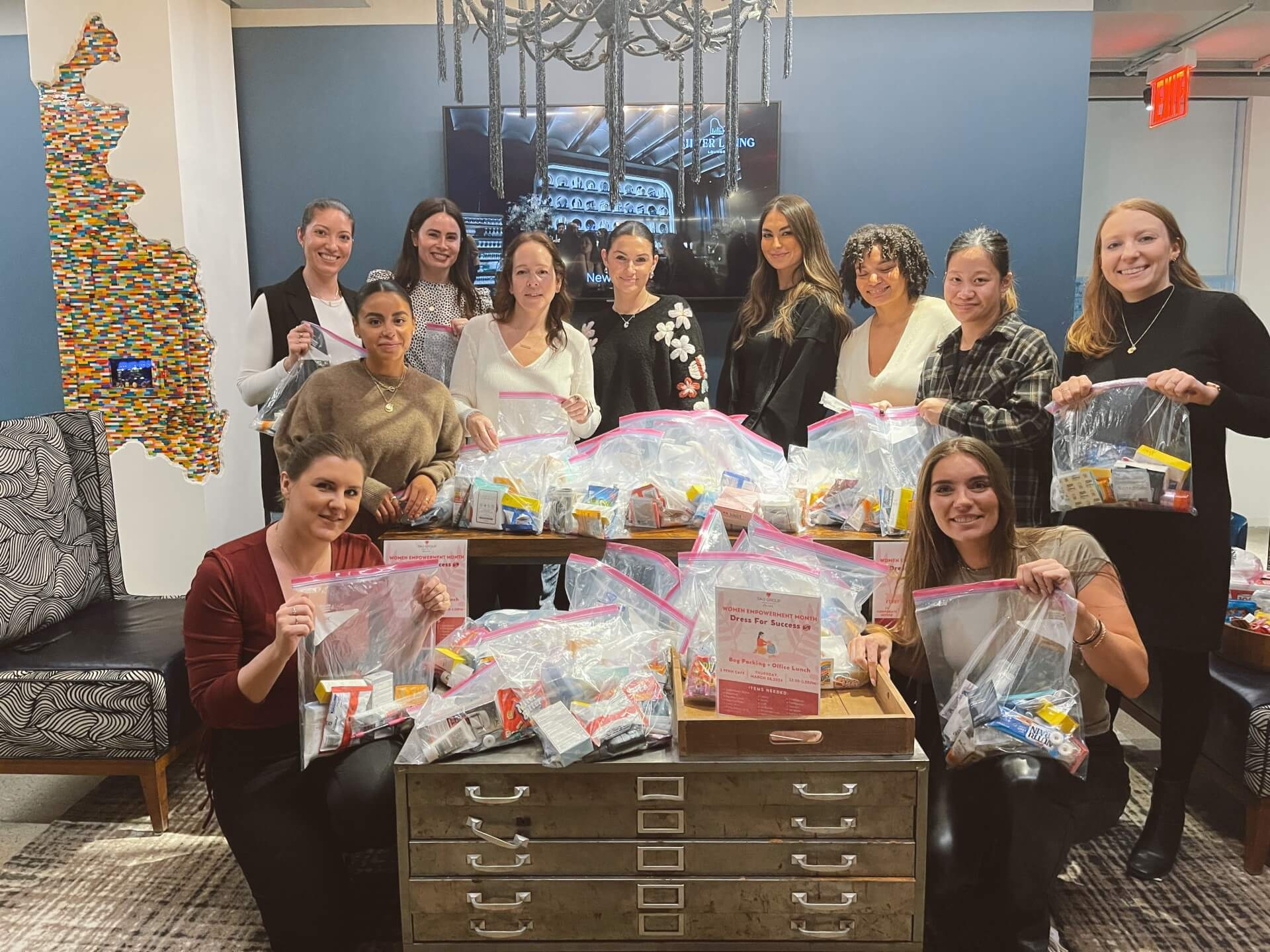 employees packing bags for charity